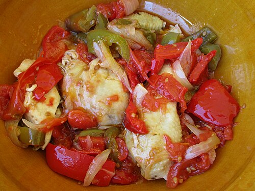 Cuisses de poulet aux poivrons et tomates